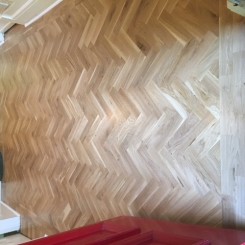 Rustic Oak Blok Flooring – laid in herringbone design with two strip border.